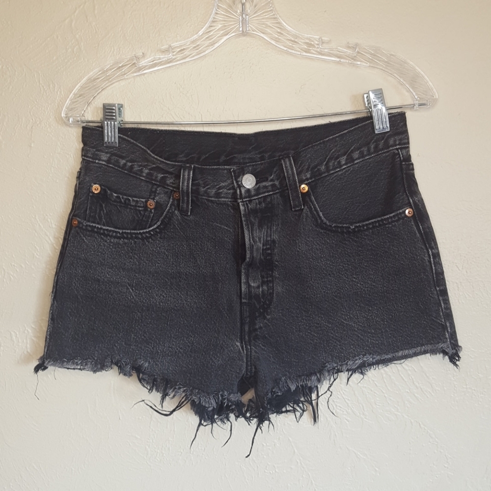 Levis  501 high rise distressed black jean shorts
